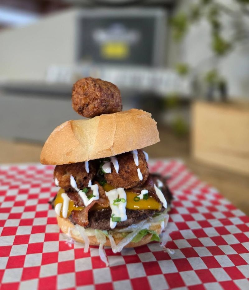 Loaded burger topped with fried tots